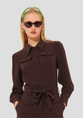 Model wearing Tara Jarmon crepe brown jumpsuit. 