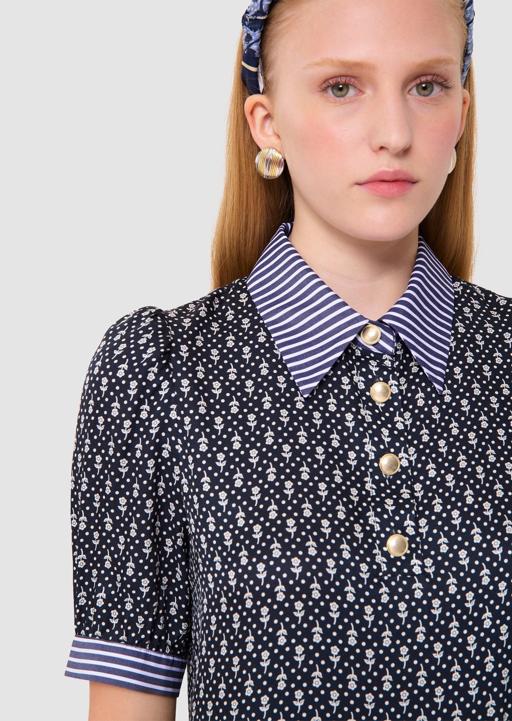 Woman wearing a Tilly midnight blue floral print top Tara Jarmon