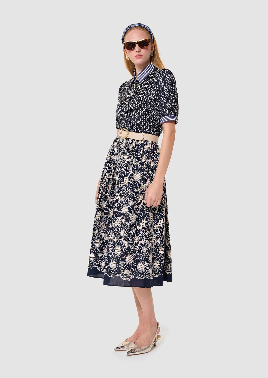Woman wearing a Tilly midnight blue floral print top Tara Jarmon