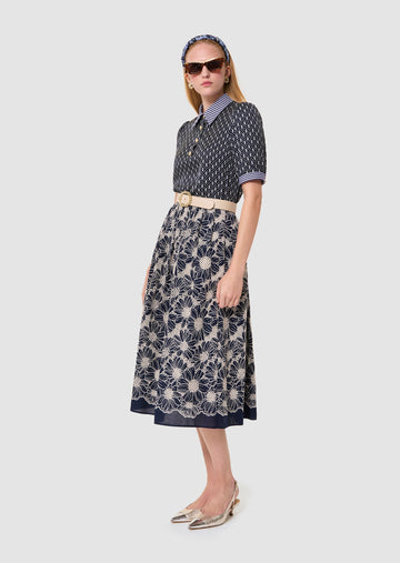 Woman wearing a Tilly midnight blue floral print top Tara Jarmon