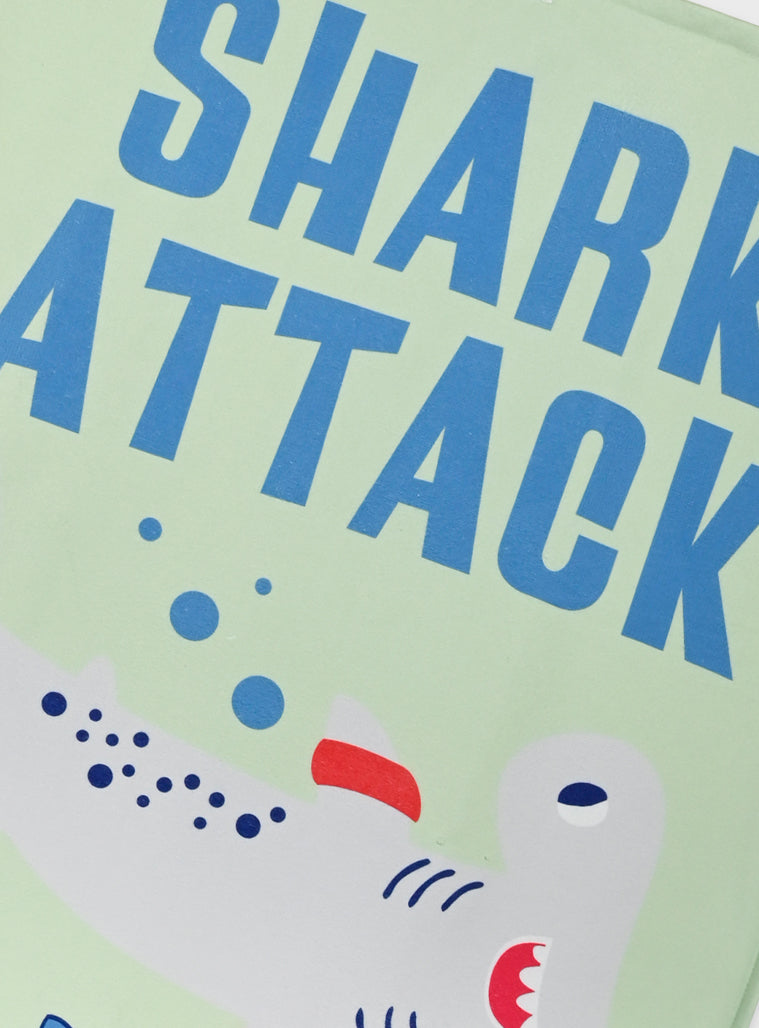 Children's towel with shark design and 'Shark Attack' text on a light green background