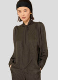 Black polka dot shirt with collar. 