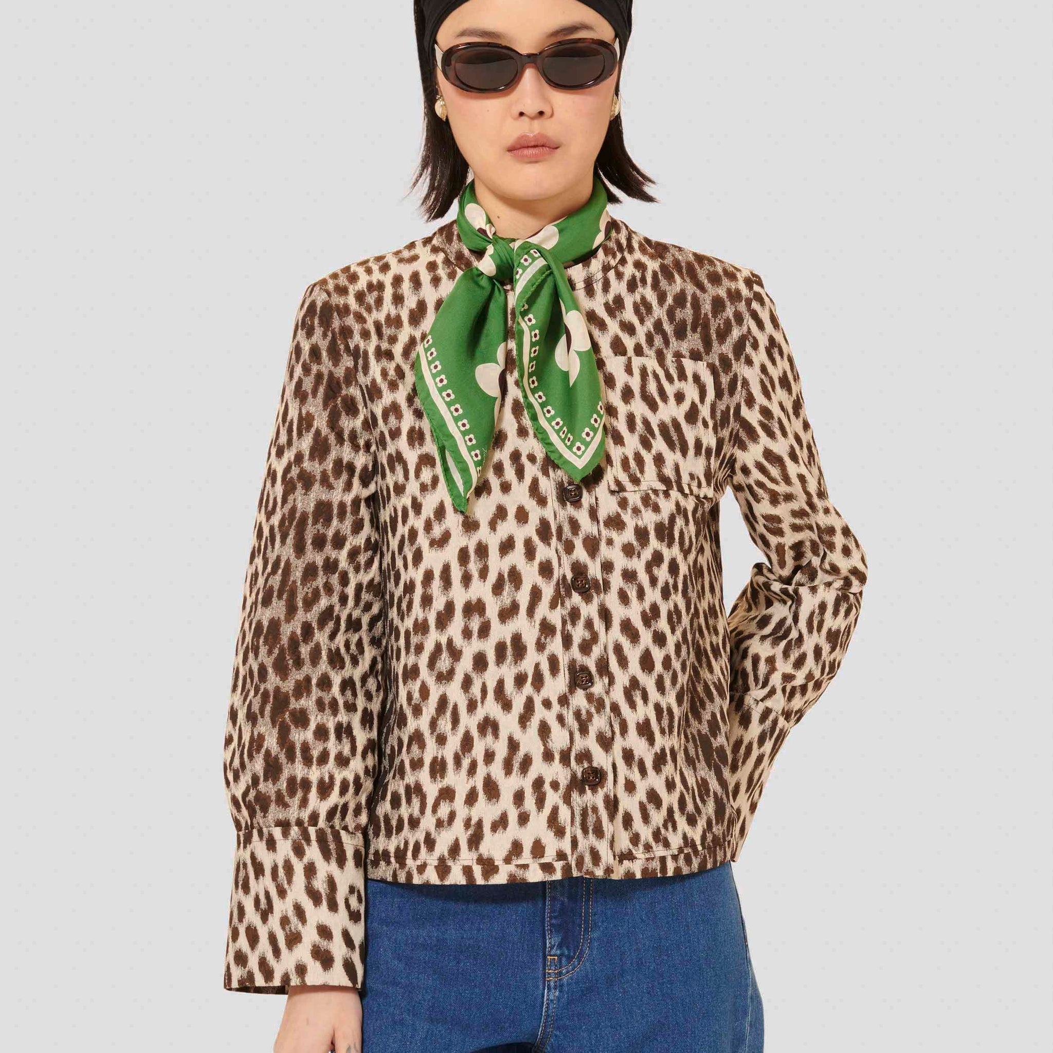 Model wearing Tara Jarmon brown woman leopard printed shirt. 
