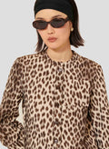 Women's brown leopard shirt with straight cut and round collar and square buttons.