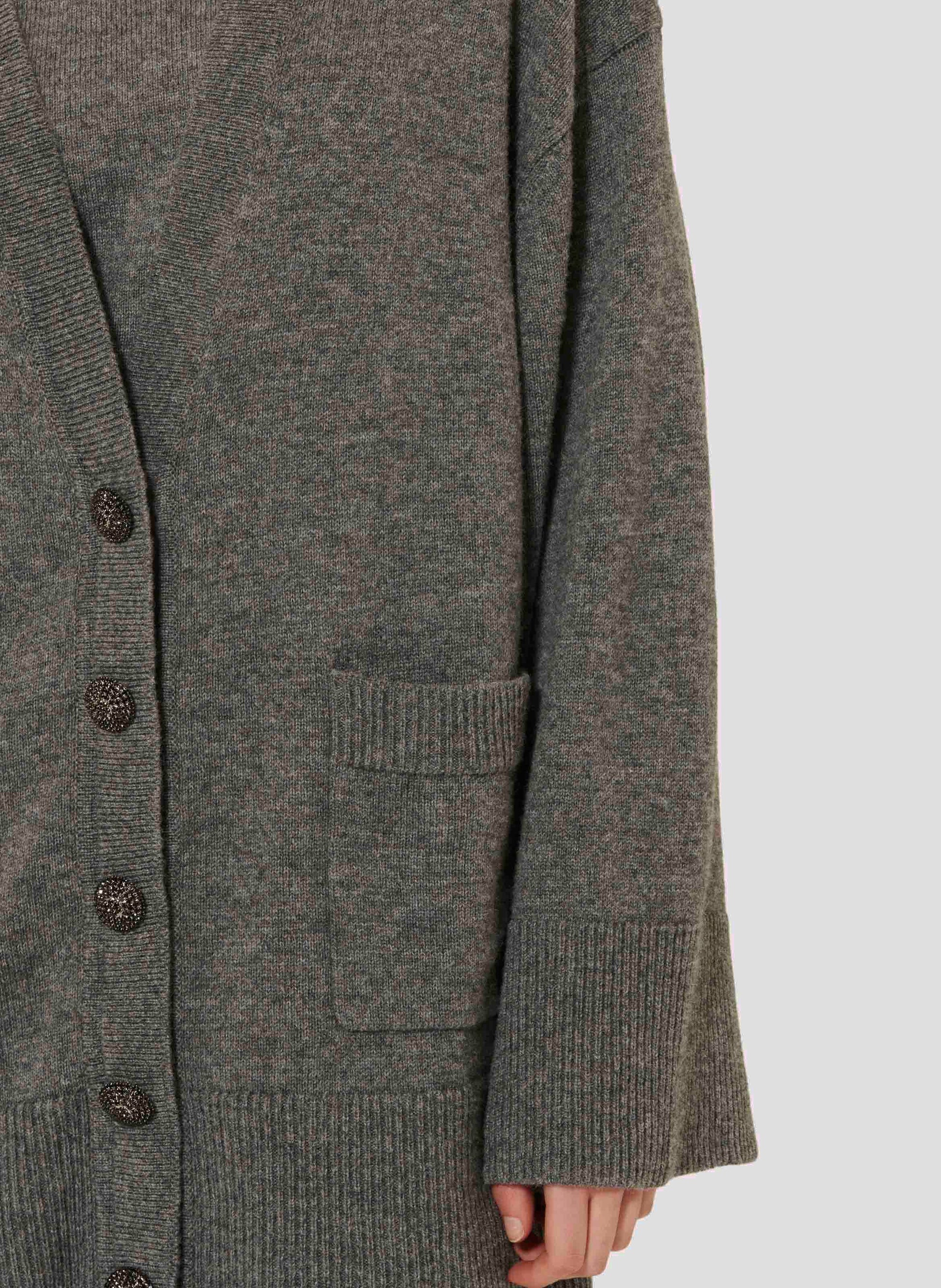 Women's oversized gray cardigan with jeweled buttons. 