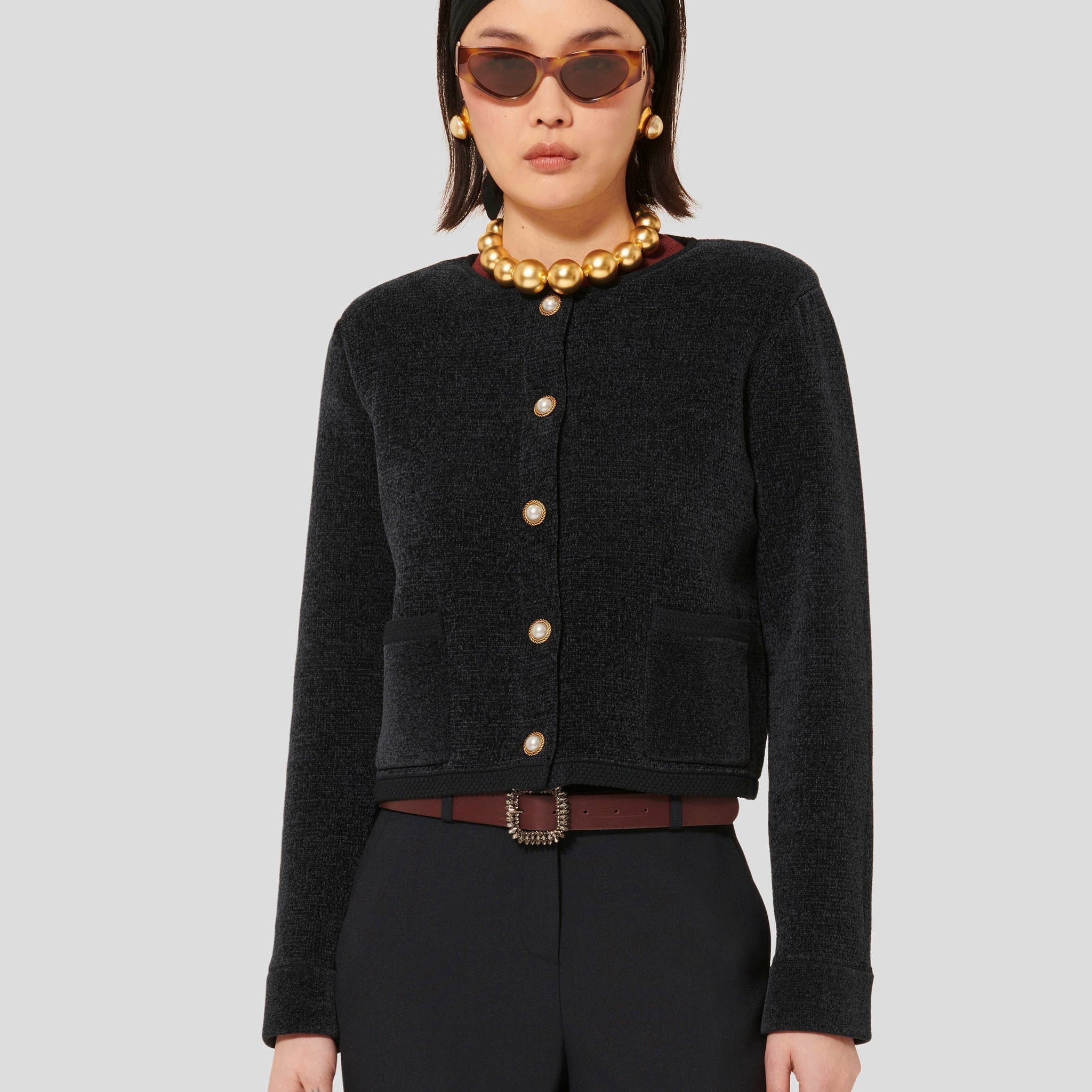 Tara Jarmon model wearing midnight blue compact knit cardigan.