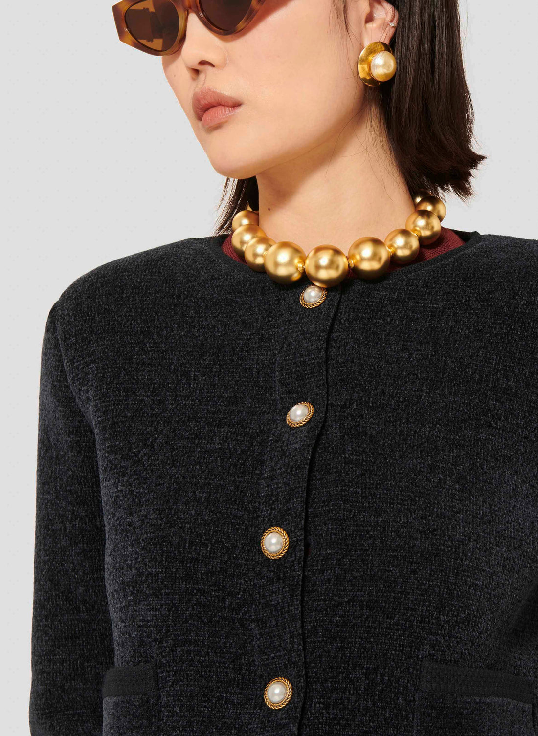 Tara Jarmon model wearing midnight blue compact knit cardigan.
