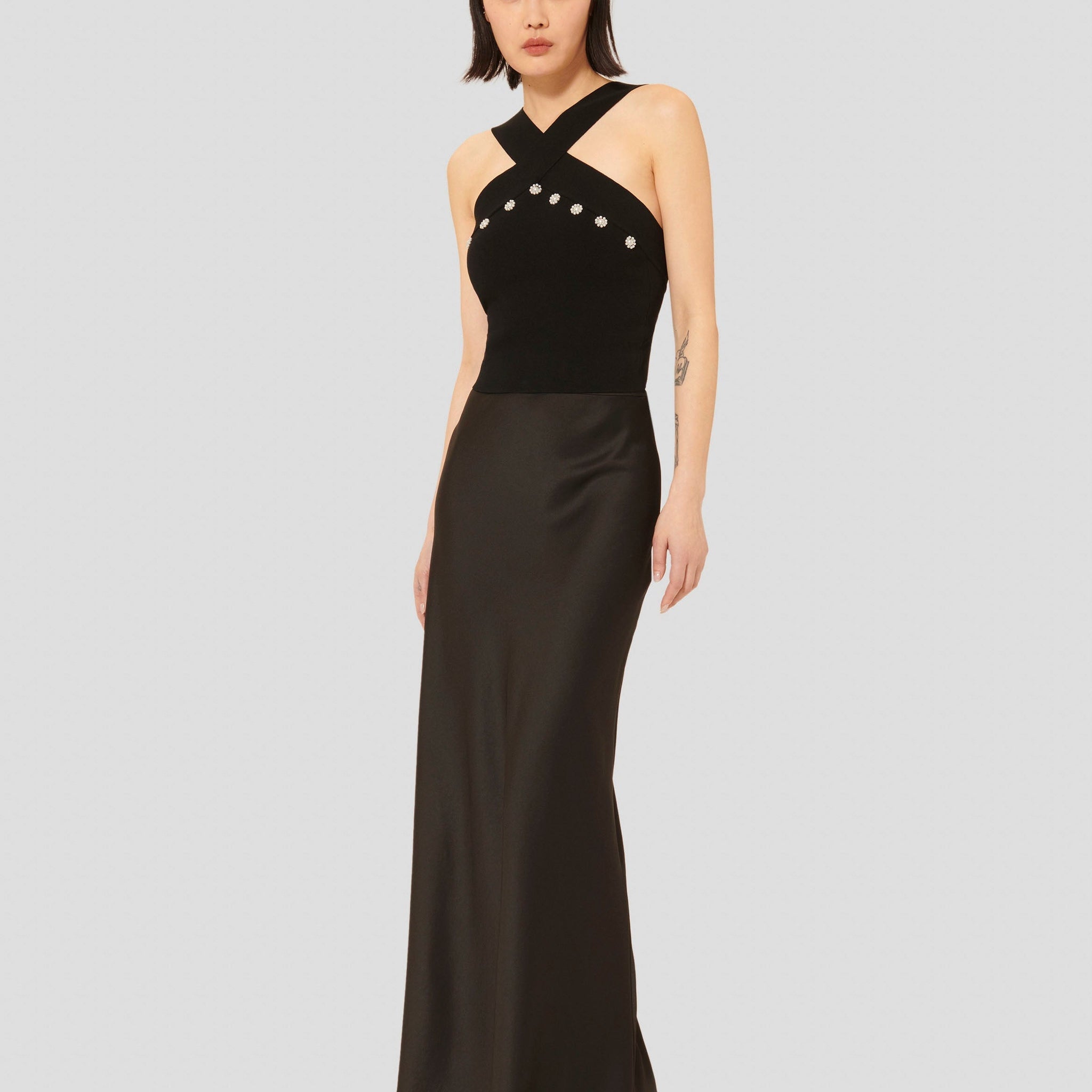 Tara Jarmon model wearing black long satin skirt