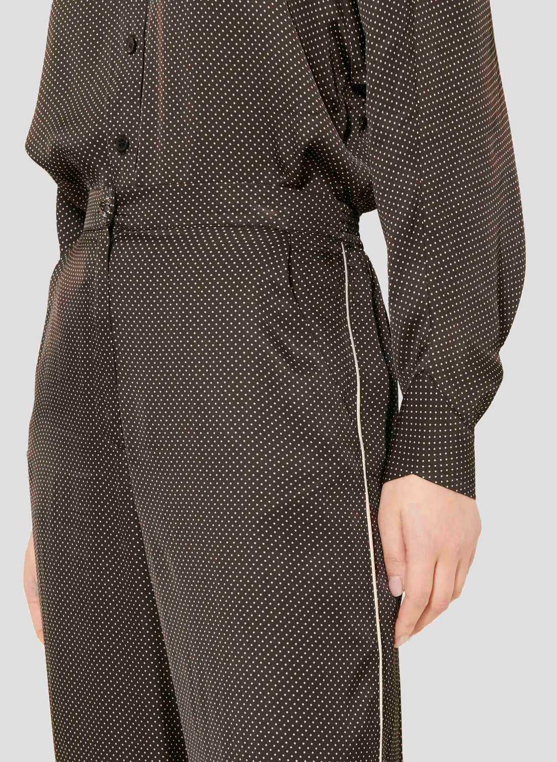 Black and White Polka Dot Pants with Side Pockets and Zip Closure.
