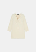 Cream-Colored Dress with Bow Detail and Cuffed Sleeves.