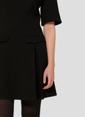 Short Black Dress with Flared Silhouette and Pleated Skirt.