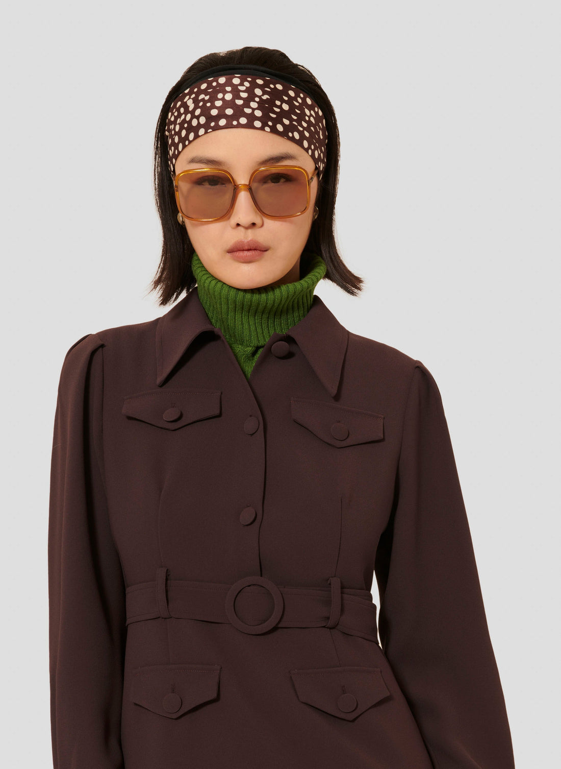Model wearing Tara Jarmon short brown crepe dress with shirt collar.