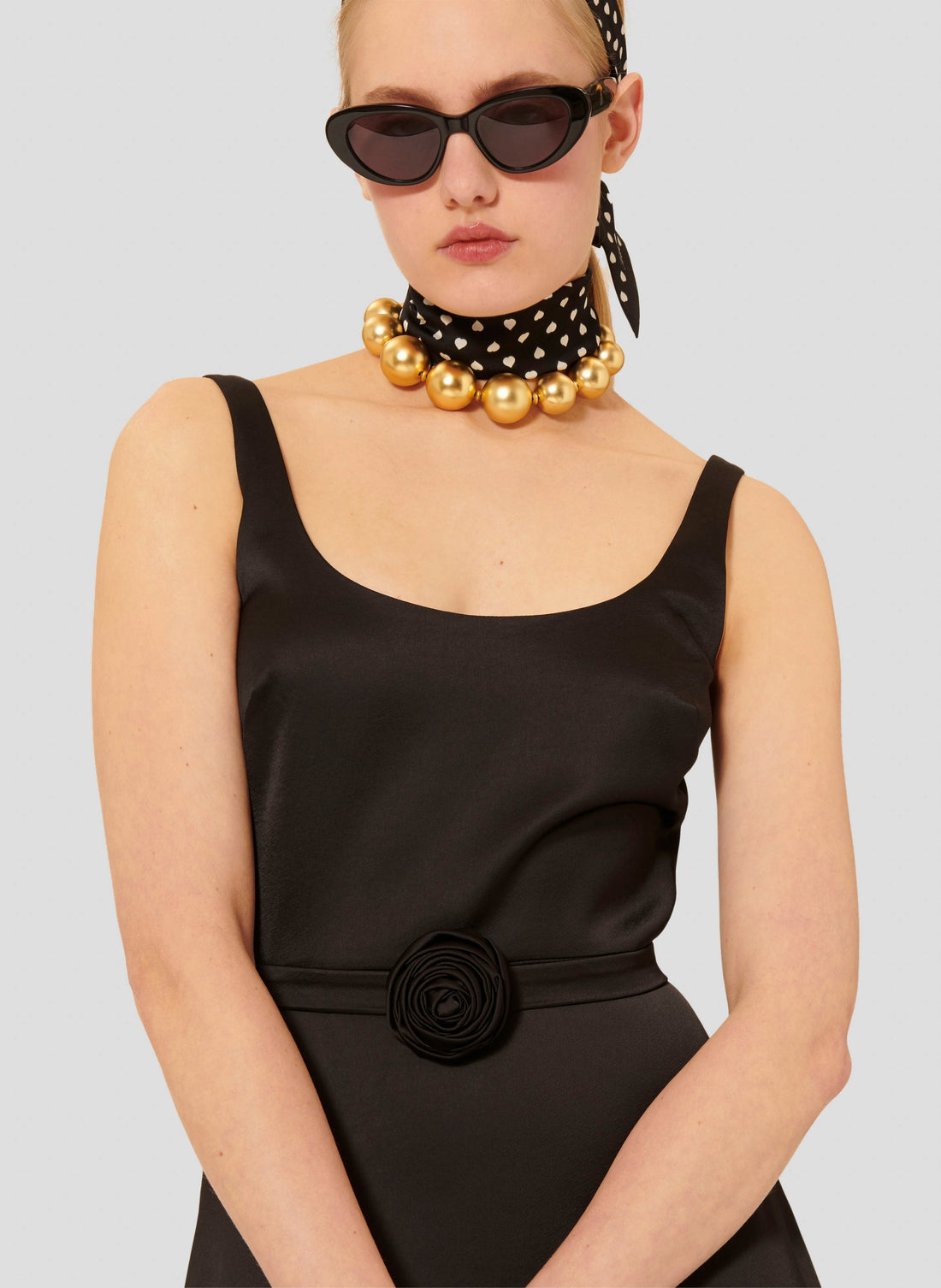 Sleeveless long satin black dress with round neckline and invisible zip.