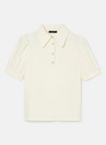 Ecru top with short balloon sleeves, buttoned cuffs, and a shirt collar.