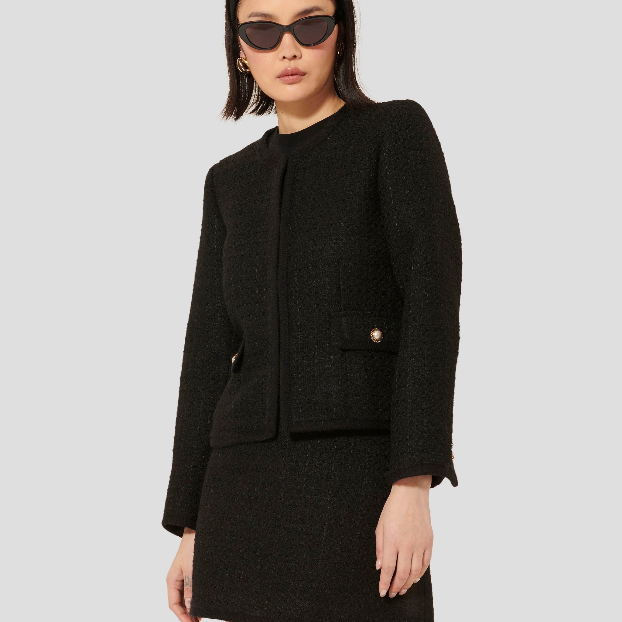 Iridescent Black Tweed Jacket with Jewel-Embellished Flap Pockets.