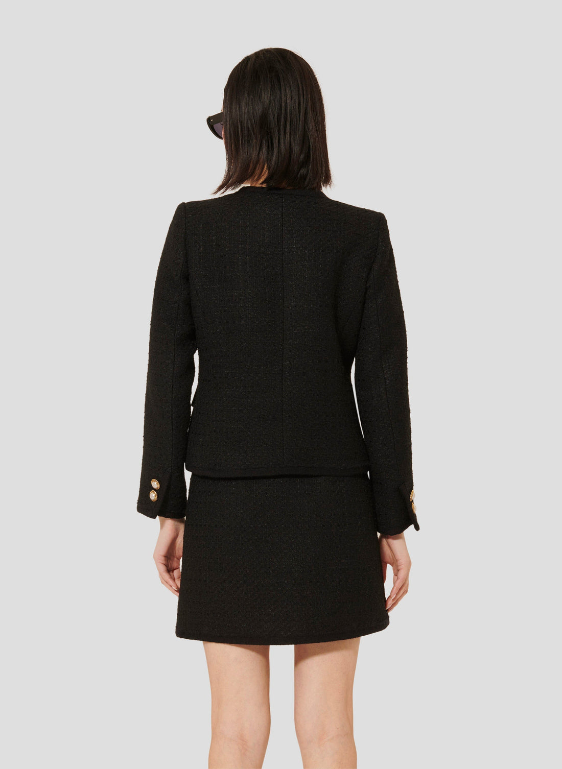 Iridescent Black Tweed Jacket with Jewel-Embellished Flap Pockets.