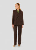 Women's chocolate brown long sleeve jacket with two side pockets. 