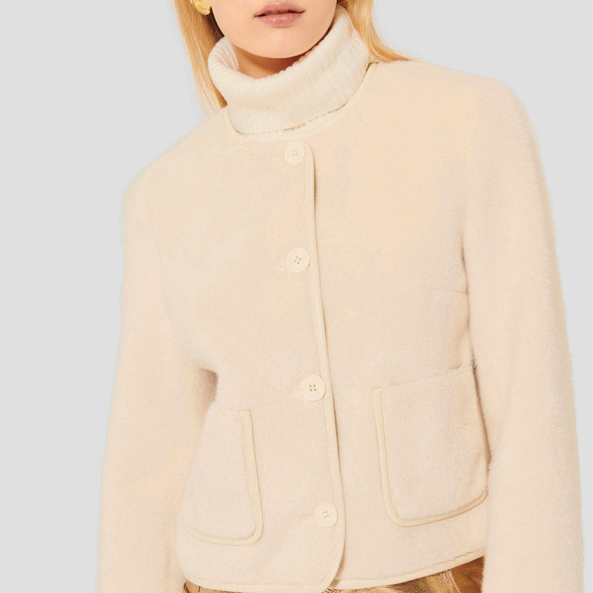 Cream Faux Fur Jacket with Round Neckline and Button Closure.