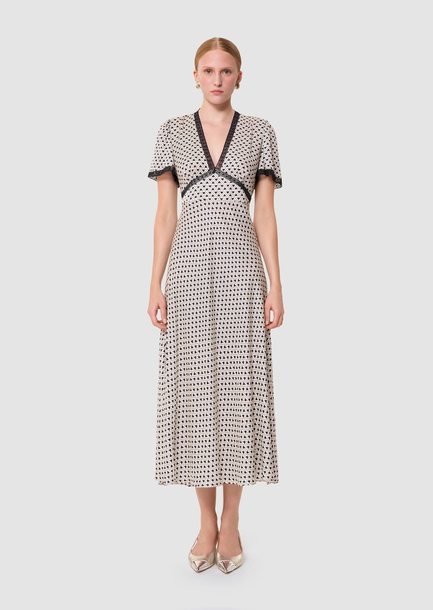 Model wearing Raoulita White Dress by Tara Jarmon Lebanon