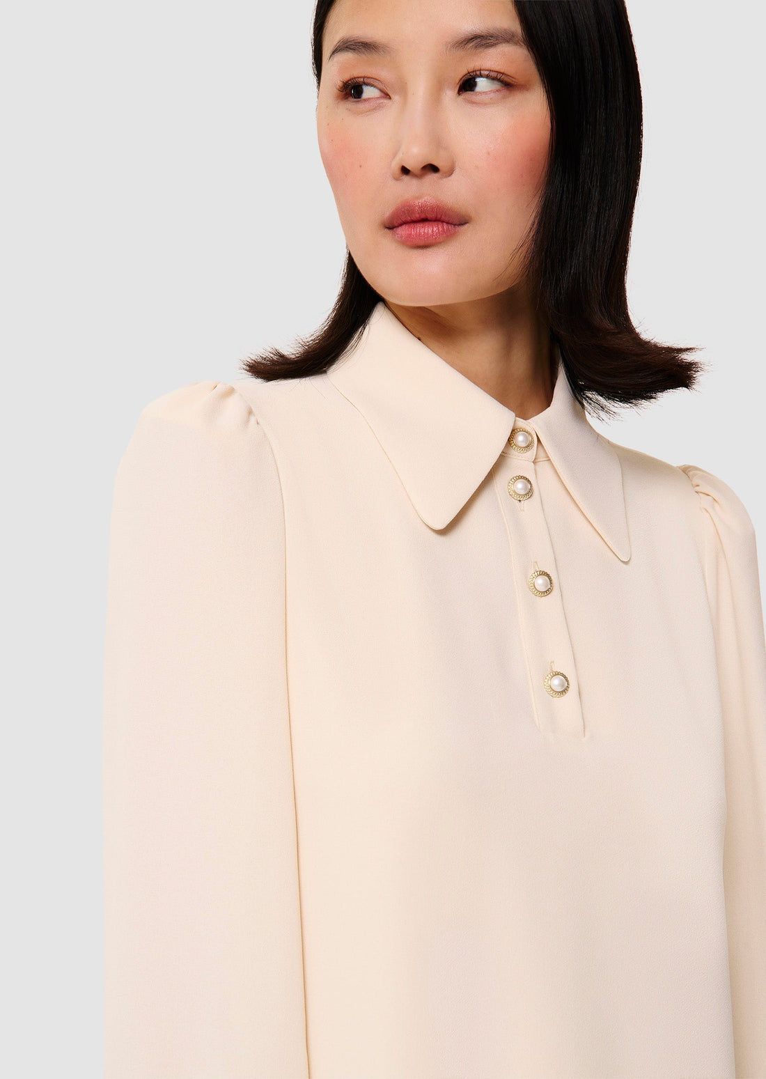 Model wearing ecru crepe dress from Tara Jarmon Lebanon