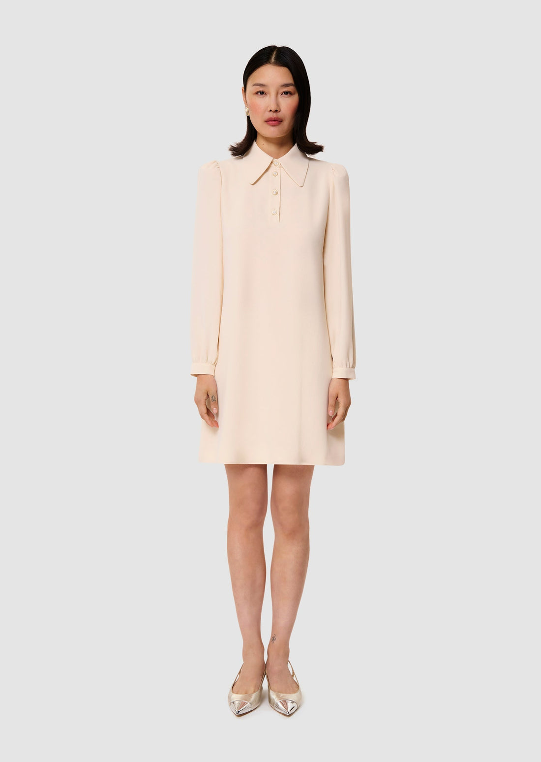 Model wearing ecru crepe dress from Tara Jarmon Lebanon