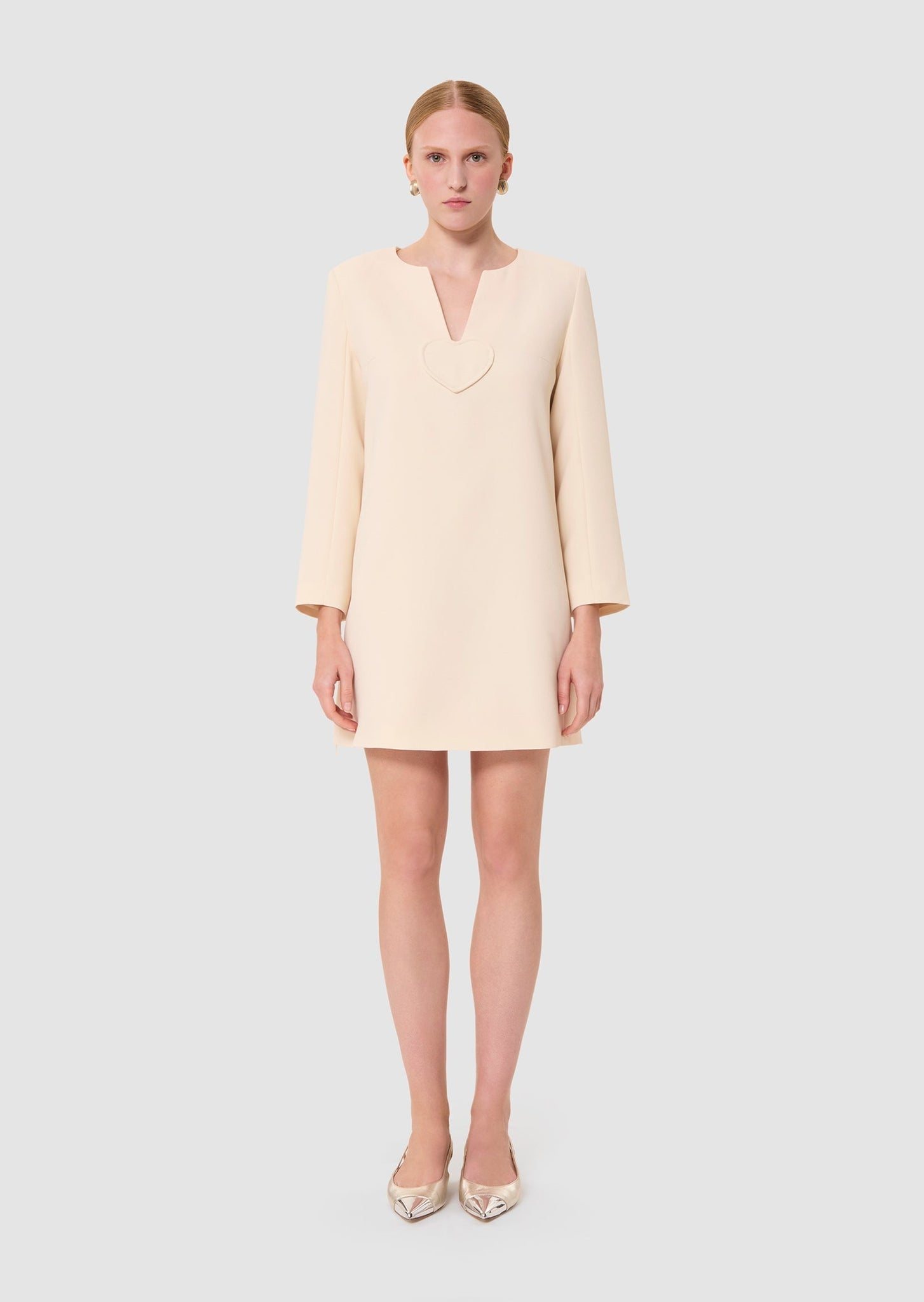 Woman wearing a light-colored ecru dress from Tara Jarmon Lebanon 