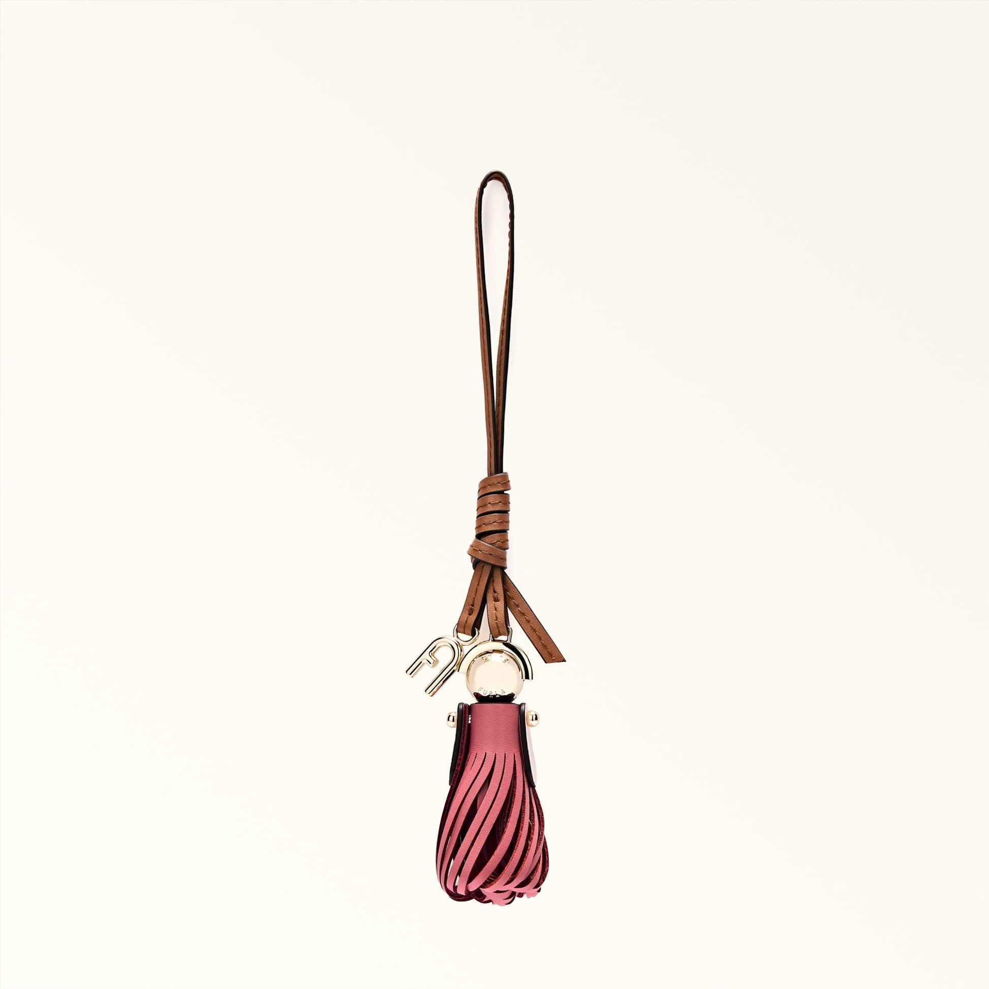 Pink tassel keychain with brown leather strap on a white background