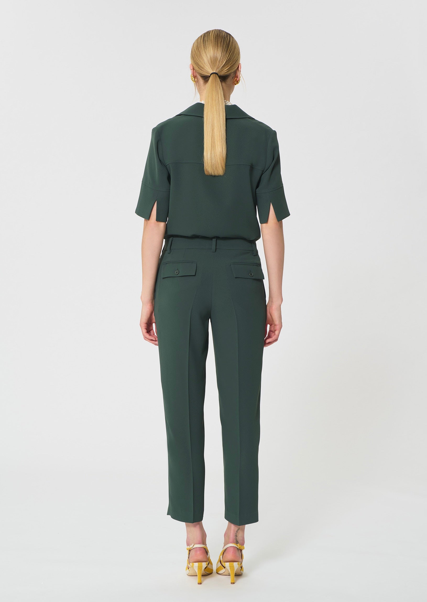 trousers in dark green in fluid crepe